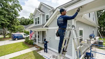 Professional house painters working on Charleston SC home exterior repaint project