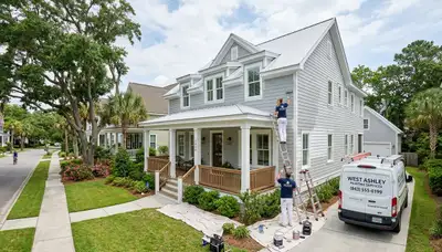Professional house painters working on exterior home repaint in Charleston, SC