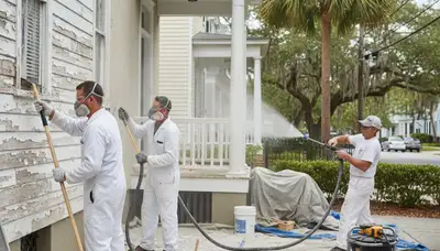 Professional surface preparation for exterior house painting in Charleston, SC before new coatings